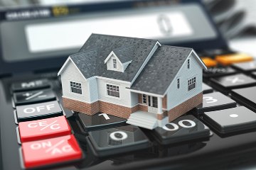 Graphic of a house on a calculator. | Unlimited Mortgage Lending